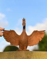 Scale Shot of Goose Wearing a Crown Garden Sculpture