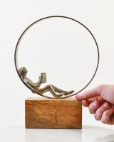 Scale image of cast aluminium and mango wood interior ornament