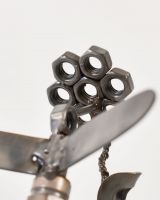 Close up of Spark Plug Hummingbird Recycled Metal Ornament flower