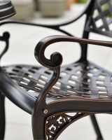 Scroll Arm Rest on Copper Chair 