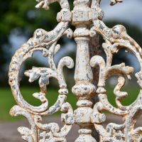 Close-up of the Detail on the Serpent Gothic Rustic Cream Cast Iron Side Table