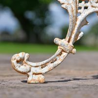Close-up o fthe Legs on the Serpent Gothic Rustic Cream Cast Iron Side Table