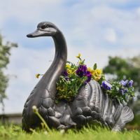 Antique Bronze Swan Flower Planter in Garden 