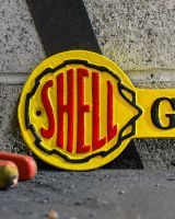 Close up of Shell Garage Classic Vintage Style Cast Iron Sign finish