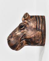 Side view of copper wall bust