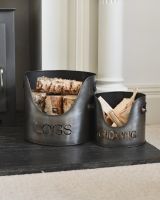 in situ photo of logs and kindling antique silver log holders