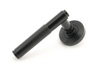 Sleek Black Textured Unsprung Lever Door Handle on Beehive Rose Handle