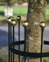 Close up of Small Black and Gold Finish Tree Guard finials