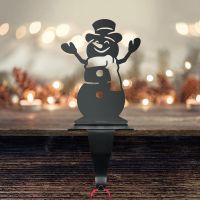 Snowman Stocking Holder in Situ on a Mantel Piece 