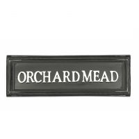 Black rectangular house sign with white letters