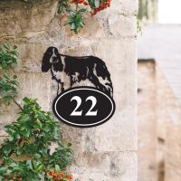 Bespoke Springer Spaniel Iron House Number Sign on a Garden Wall