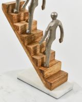 Close up of solid mango wood stair detail on home decor sculpture