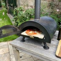 Steel Table Top Pizza Oven in Use Cooking a Pizza