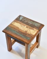 Close up of rustic top on reclaimed wooden stool