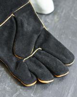 Close Up Of Suede Black & Orange Fireside Gloves Fingers