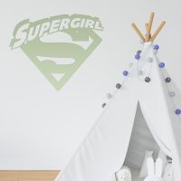 "Supergirl" Wall Art in a Children"s Play Room