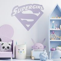 "Supergirl" Wall Art in a Children"s Play Room Next to Toys