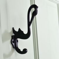 Swan Cast Iron Hooks in Situ on a Green Door