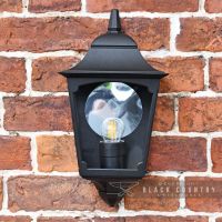 Front View of the "Tattershall Thorpe" Black Half Wall Lantern on a Brick Wall