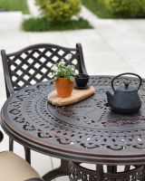 Ornate Table with Teapot and Plant 
