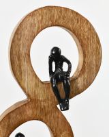 Close up of trailing thought sculpture black cast aluminium figure