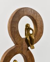 Close up of cast aluminium gold figure detail 