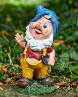 Angled view of colourful garden gnome statue