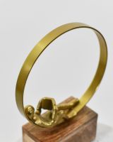 Close up of gold detail on reading home decor sculpture
