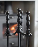 Close up of traditional powder coated black handles on fireside companion set