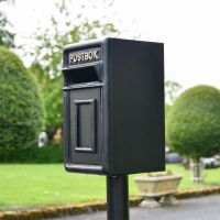 View of the Side of the Traditional Black & Gold Post Box on a Stand