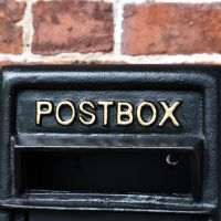 Close-up o fthe Gold Text on the Front of the Post box