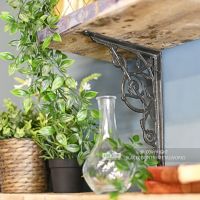 Trellis Iron Shelf Bracket in Situ Holding Up a Wooden Shelf 