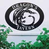 Tribal Dragon Iron Oval House Sign on a White Wall