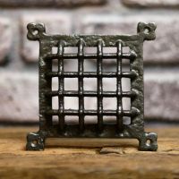 Cast iron grill air vent cover for brick wall