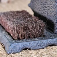 Close up of brush and cast iron base 
