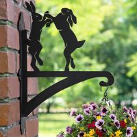 Boxing Hares Hanging Basket Bracket in Garden Setting 