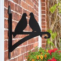 Pair of Doves Hanging Basket Bracket Mounted onto a Brick Wall 