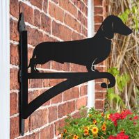Dachshund Hanging Basket Bracket on a Brick Wall in the Garden