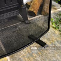 Close-up of the Feet on the Bottom of the Fire Screen