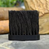 Replacement Oblong Fireside Brush Head Next to Fireside Logs