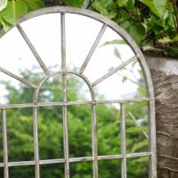 Close up of Arched Metal Mirror 