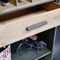 Close up of wooden drawer with metal handle 