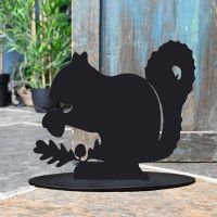 Squirrel Iron Door Stop Next to a Rustic Blue Door