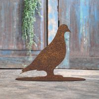 Pigeon Rustic Iron Door Stop in Front of a Rustic Blue Door