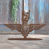 British Parachute Regiment Rustic Iron Door Stop in Front of a Rustic Blue Door