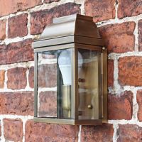 Flush fit wall lantern finished in antique brass