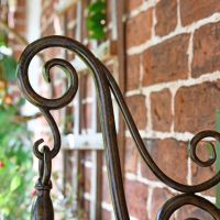 Close up of scroll supporting arm 
