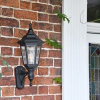 Traditional wall lantern mounted to wall 