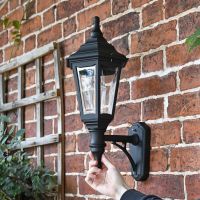 Traditionally designed wall lantern mounted to wall 