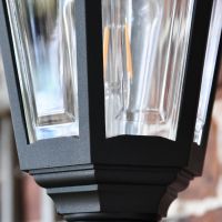 Close up of wall mounted lantern frame and glass panes 
